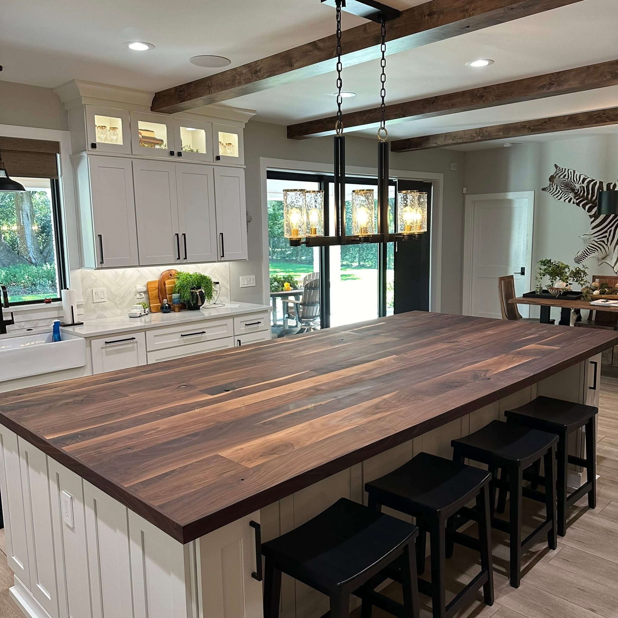 Custom walnut kitchen island with exposed beams