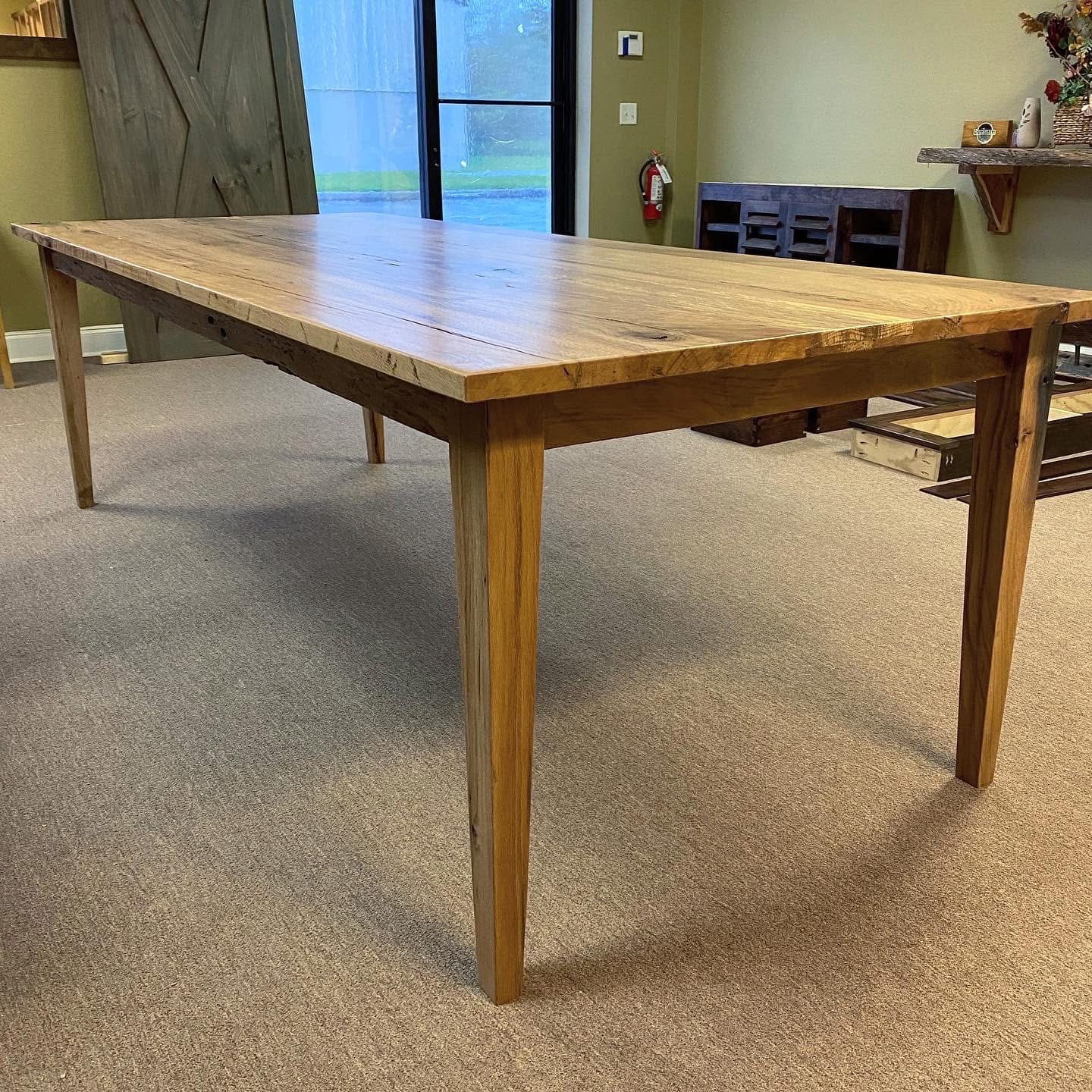 Large harvest dining table in showroom