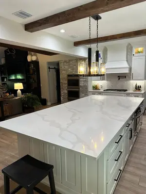 Luxury kitchen with marble counter and wood beams