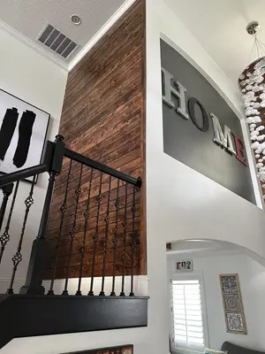 Stairwell with reclaimed wood accent wall